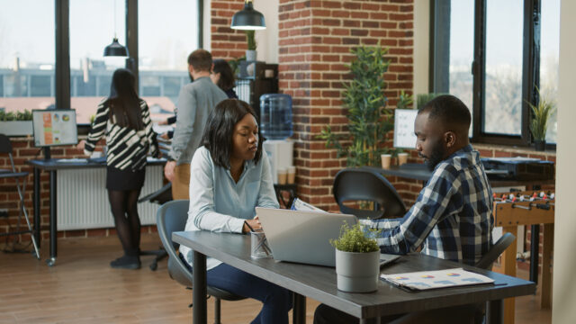 African american people greeting at job interview appointment, talking about HR recruitment and work application. Man and woman meeting to talk about executive career opportunity.